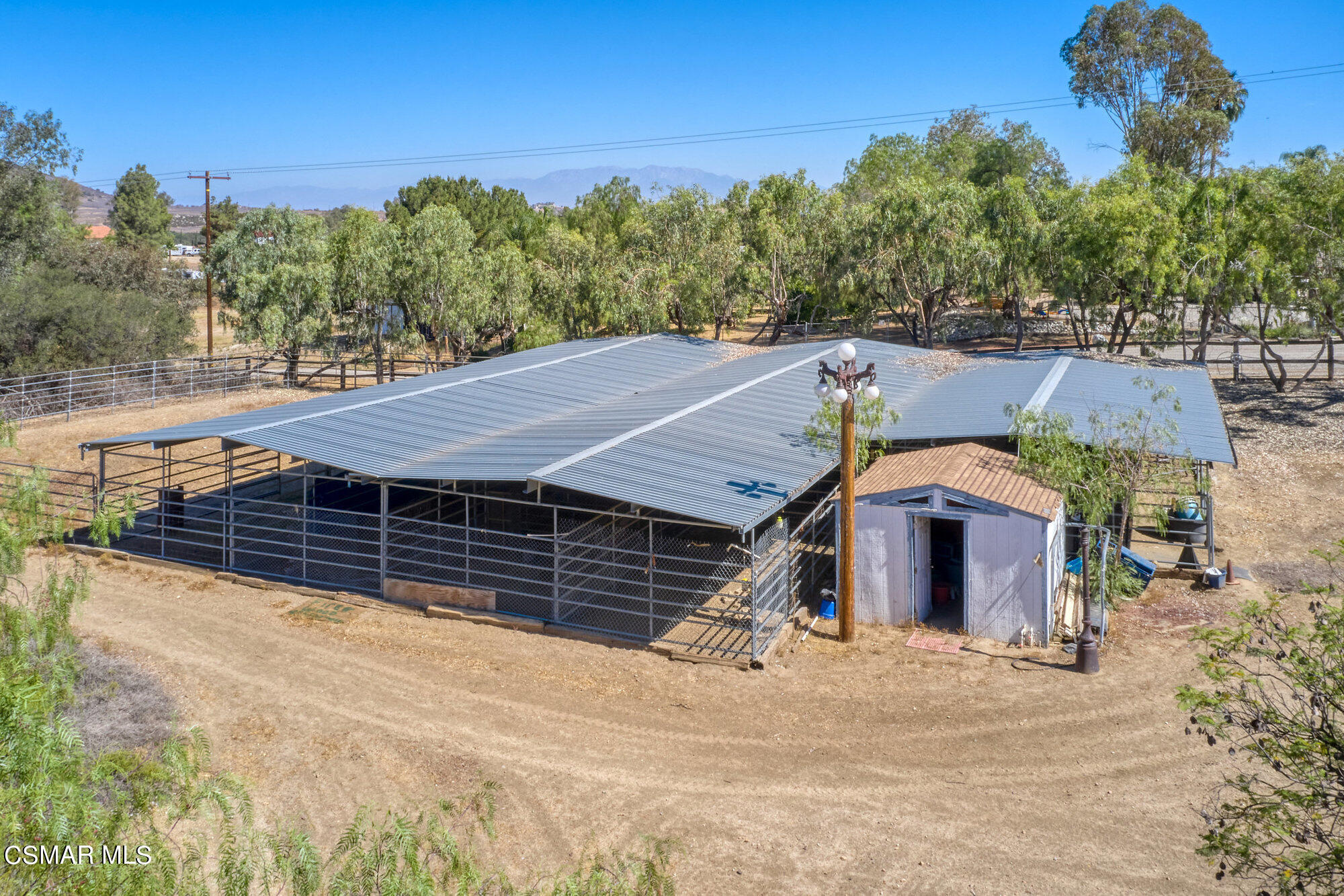 17498 Santa Rosa Mine Road Perris, CA 92570 - Photo 22 of 55 a front view of a house with a garden