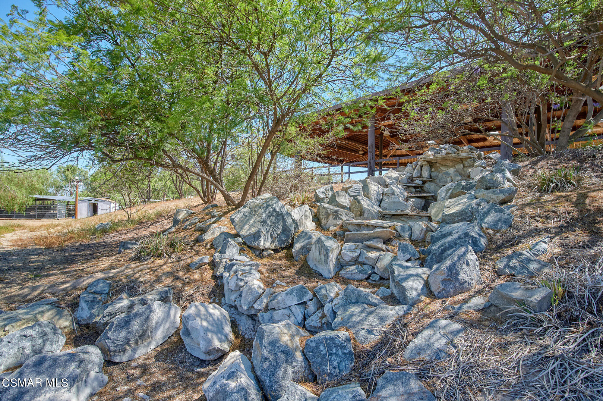 17498 Santa Rosa Mine Road Perris, CA 92570 - Photo 30 of 55 a backyard of a house with lots of green space