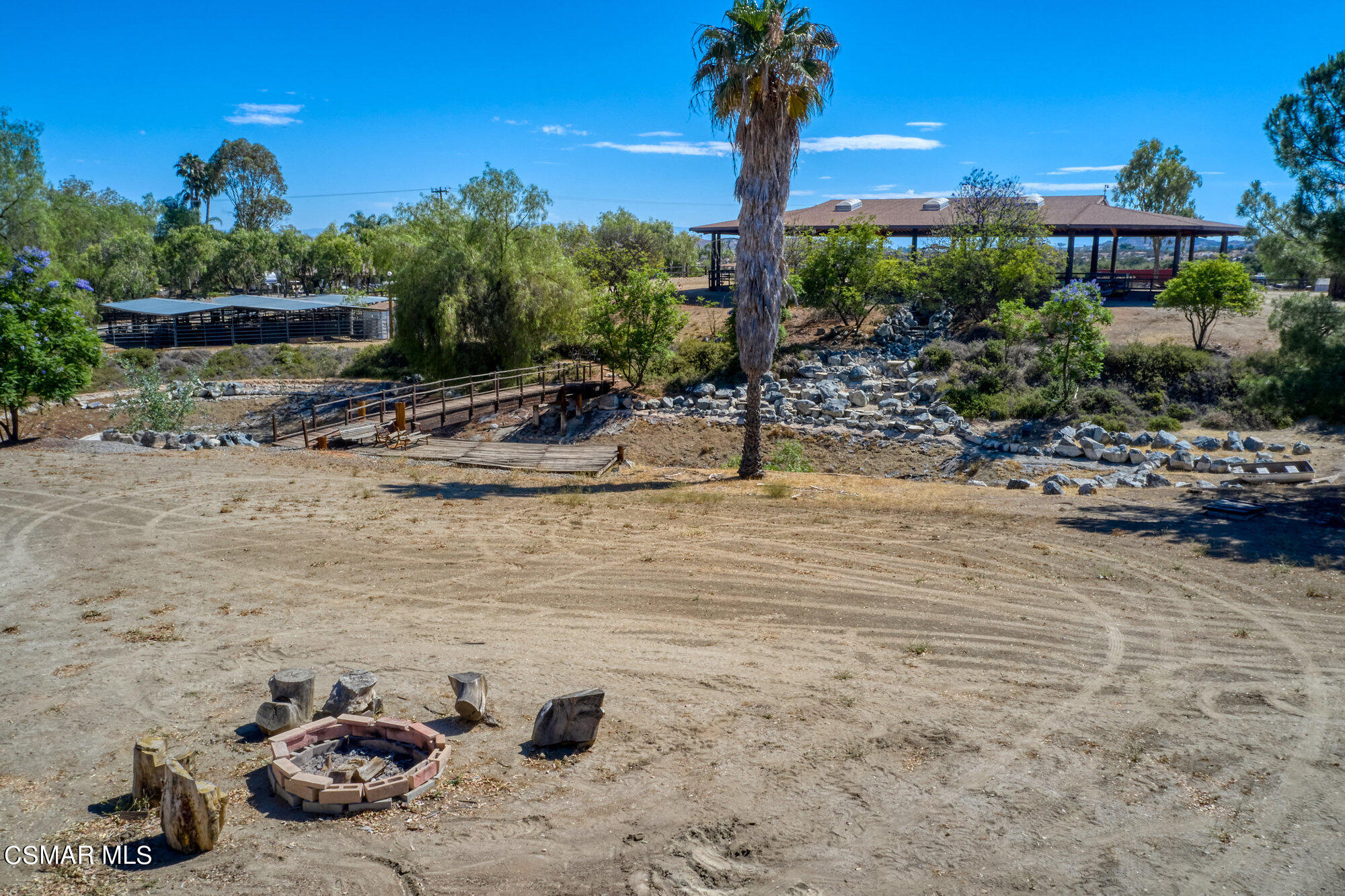 17498 Santa Rosa Mine Road Perris, CA 92570 - Photo 31 of 55 a view of a terrace with a bench and trees around