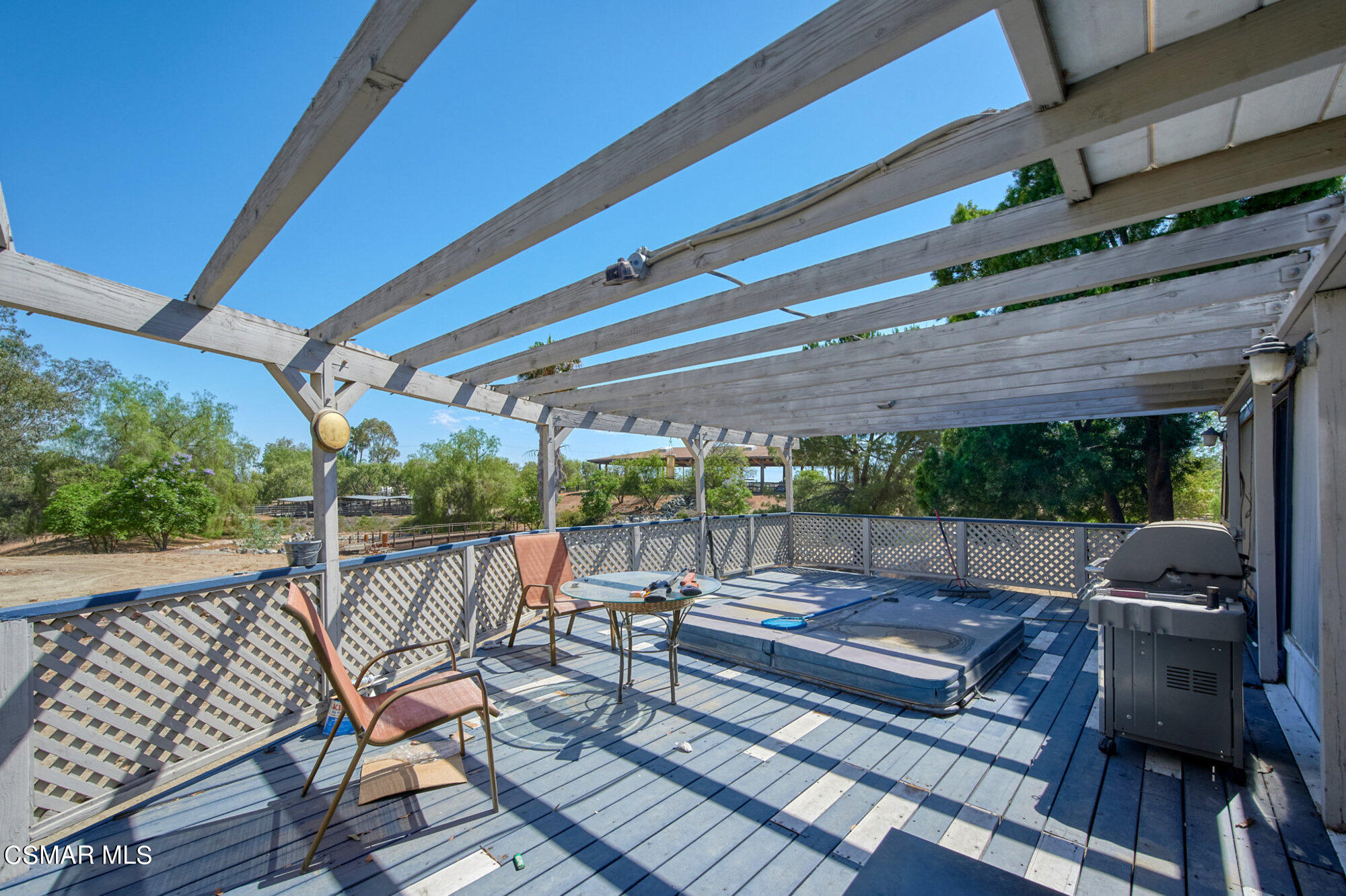 17498 Santa Rosa Mine Road Perris, CA 92570 - Photo 33 of 55 a sitting area with furniture on wooden deck