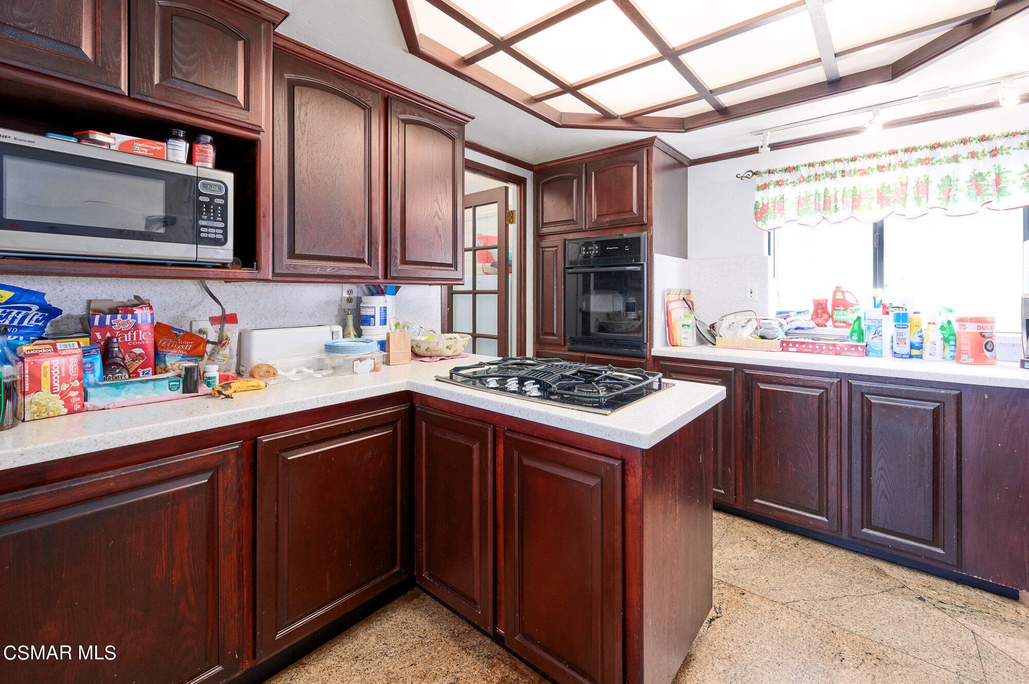 17498 Santa Rosa Mine Road Perris, CA 92570 - Photo 44 of 55 a kitchen with a stove and a sink