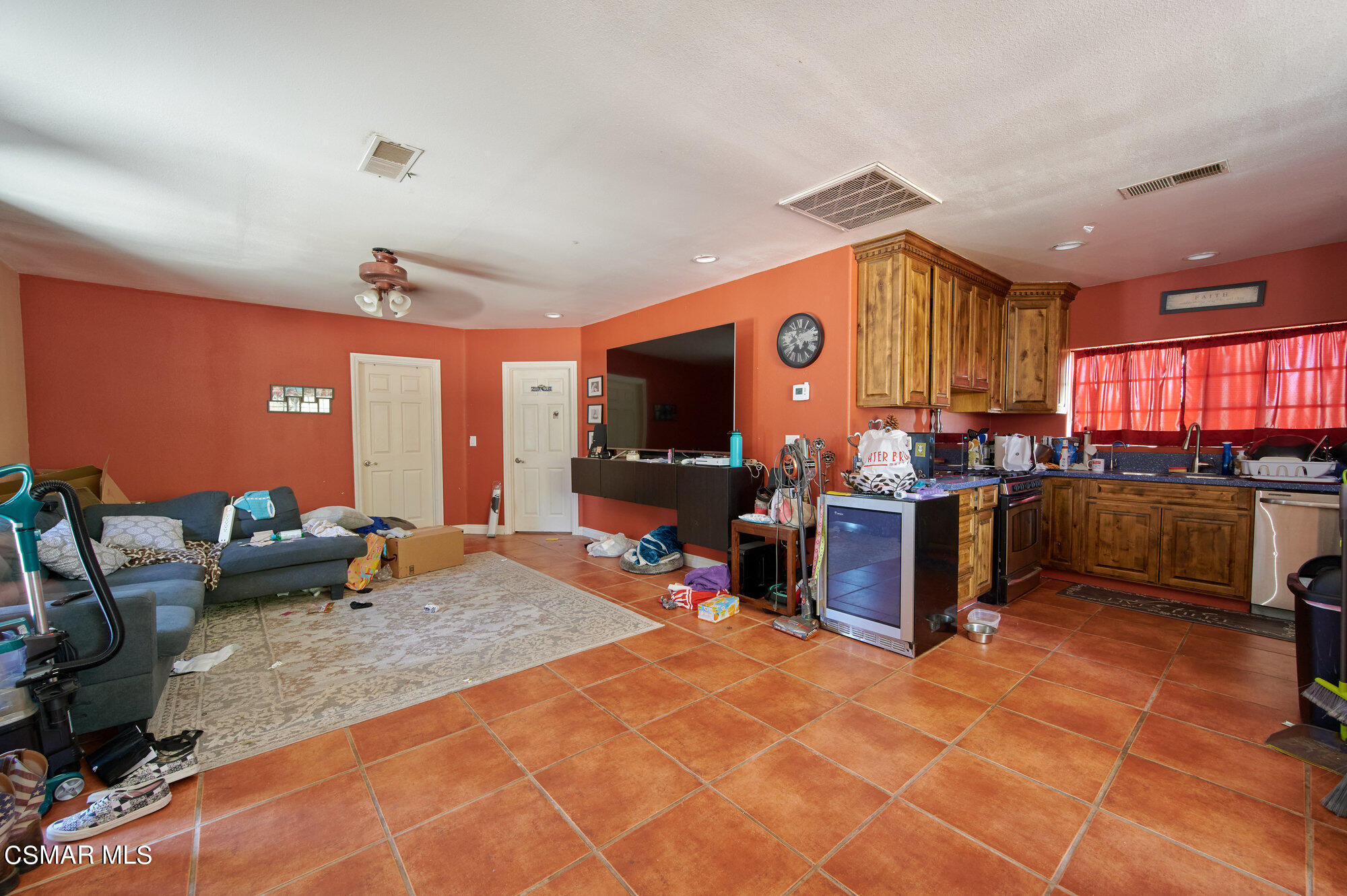 17498 Santa Rosa Mine Road Perris, CA 92570 - Photo 49 of 55 a living room with lots of furniture and kitchen view