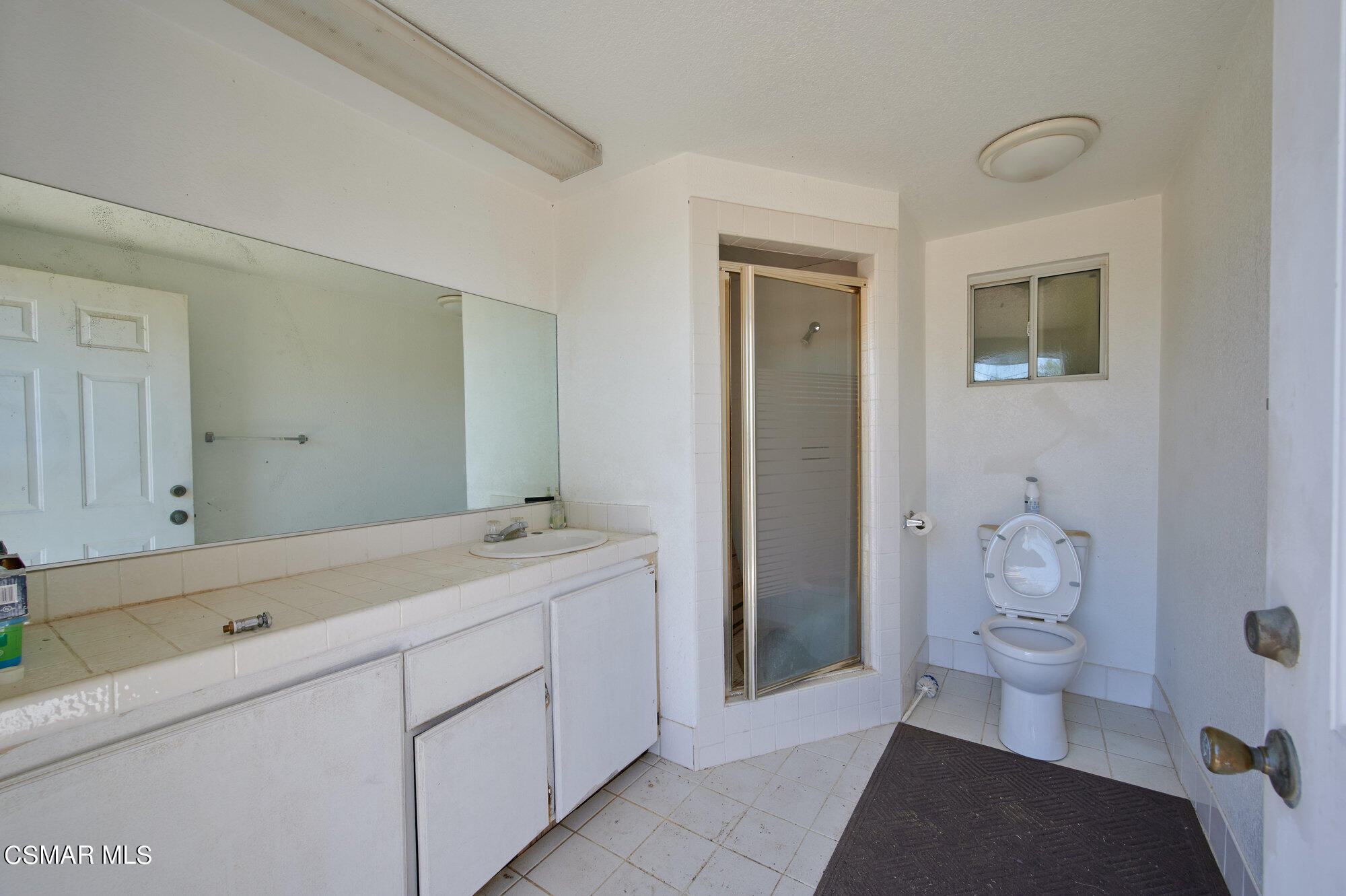 17498 Santa Rosa Mine Road Perris, CA 92570 - Photo 53 of 55 a bathroom with a sink a toilet and shower