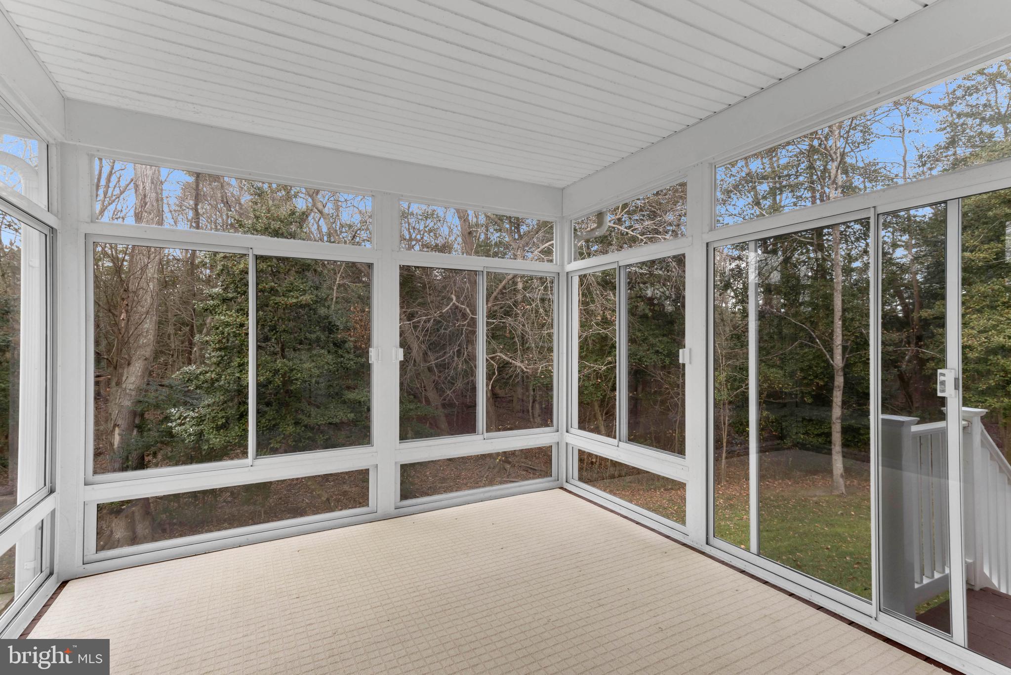 24872 Rivers Edge Road Millsboro, DE 19966 - Photo 16 of 80 a view of an empty room with a sliding door