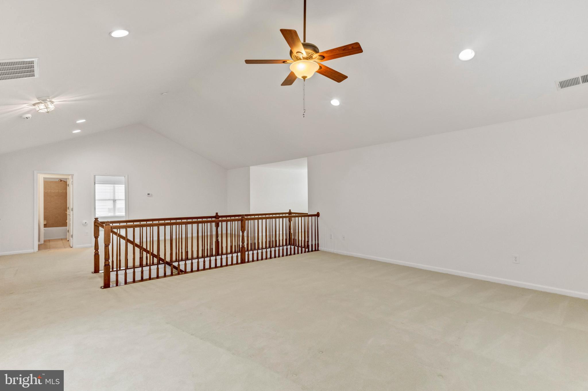 24872 Rivers Edge Road Millsboro, DE 19966 - Photo 42 of 80 an empty room with ceiling fan and window