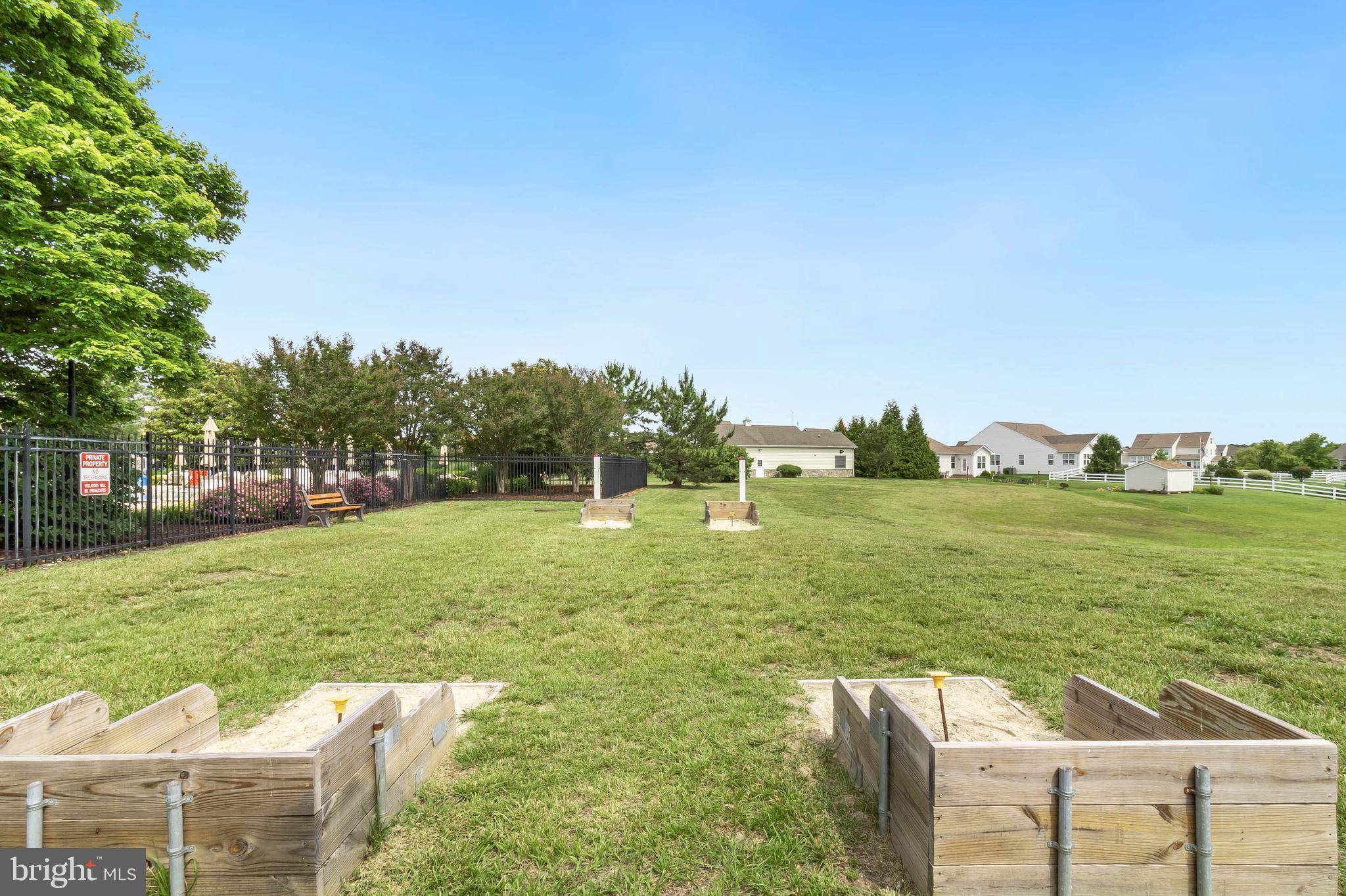 24872 Rivers Edge Road Millsboro, DE 19966 - Photo 77 of 80 a balcony with view of lake and trees