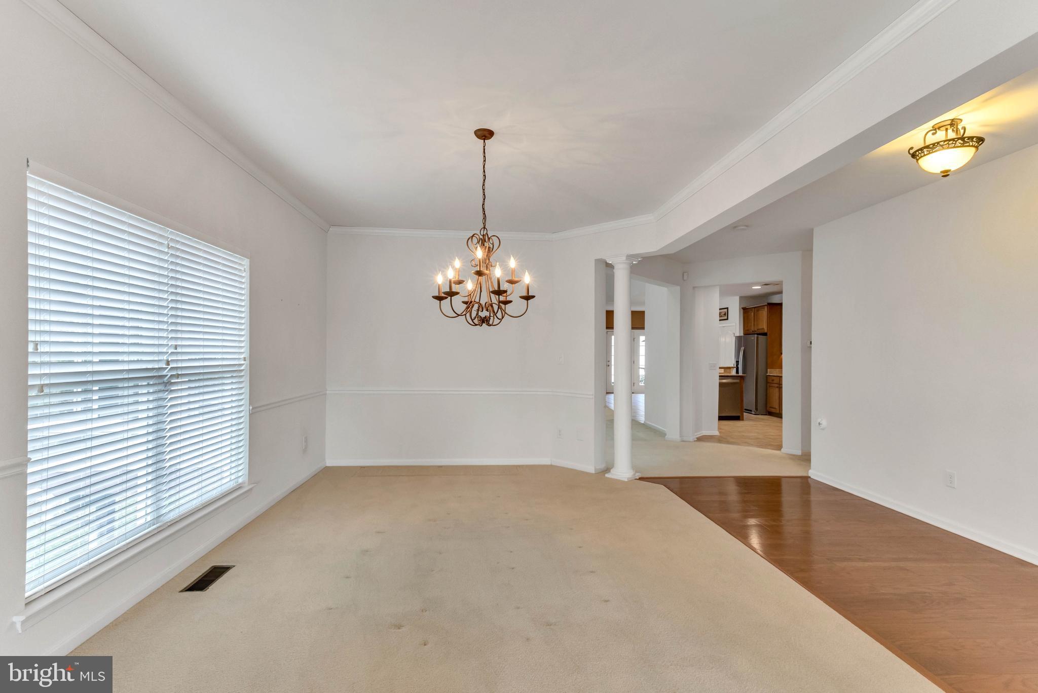 24872 Rivers Edge Road Millsboro, DE 19966 - Photo 9 of 80 a very nice looking room with a chandelier