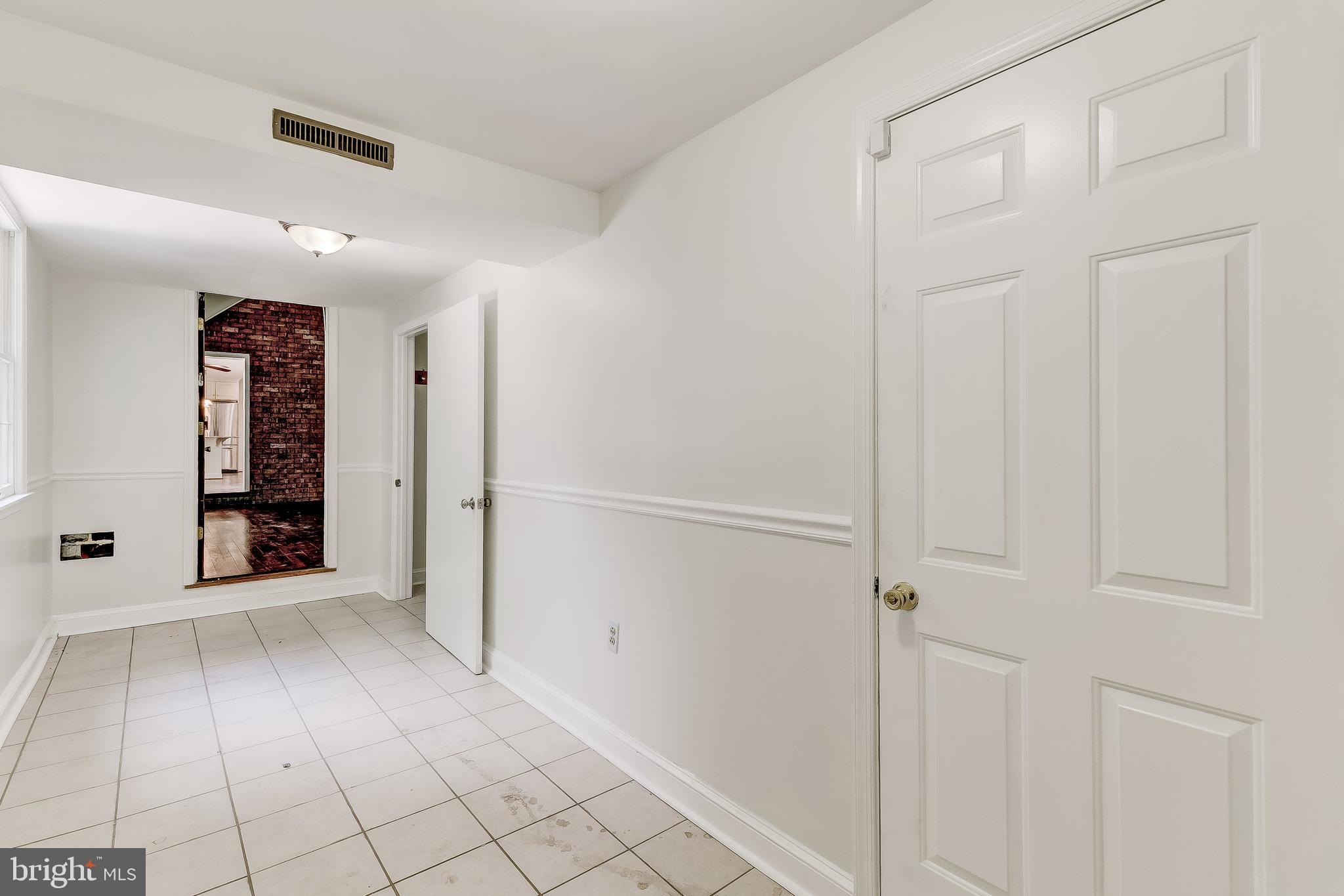 12500 Timber Grove Road Reisterstown, MD 21136 - Photo 29 of 89 Hall from back door, door to garage & apt, to FR