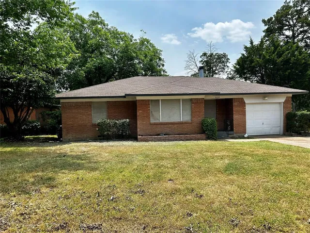 a house view with a garden space