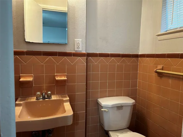 a bathroom with a sink and mirror