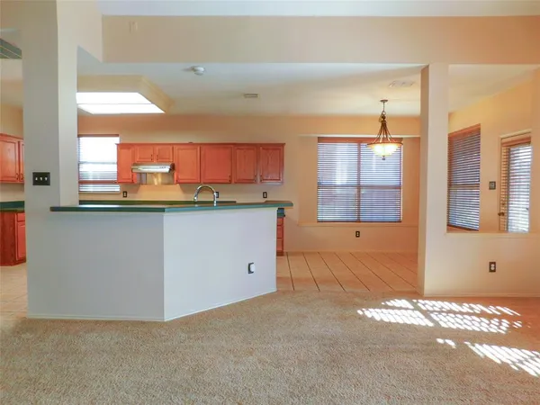a kitchen with a sink cabinets and window