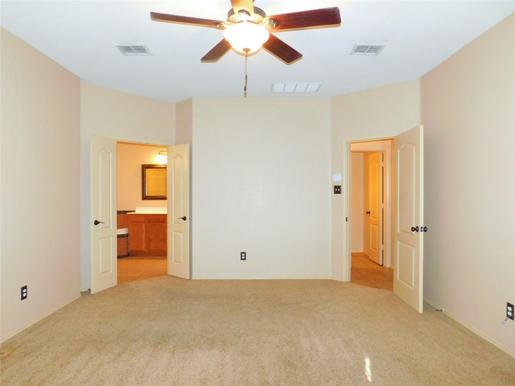 2724 Hereford Road Denton, TX 76210 - Photo 15 of 34 a view of a big room with closet and chandelier fan