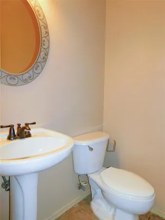 a bathroom with a toilet and a sink
