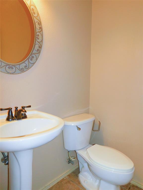 2724 Hereford Road Denton, TX 76210 - Photo 20 of 34 a bathroom with a toilet and a sink