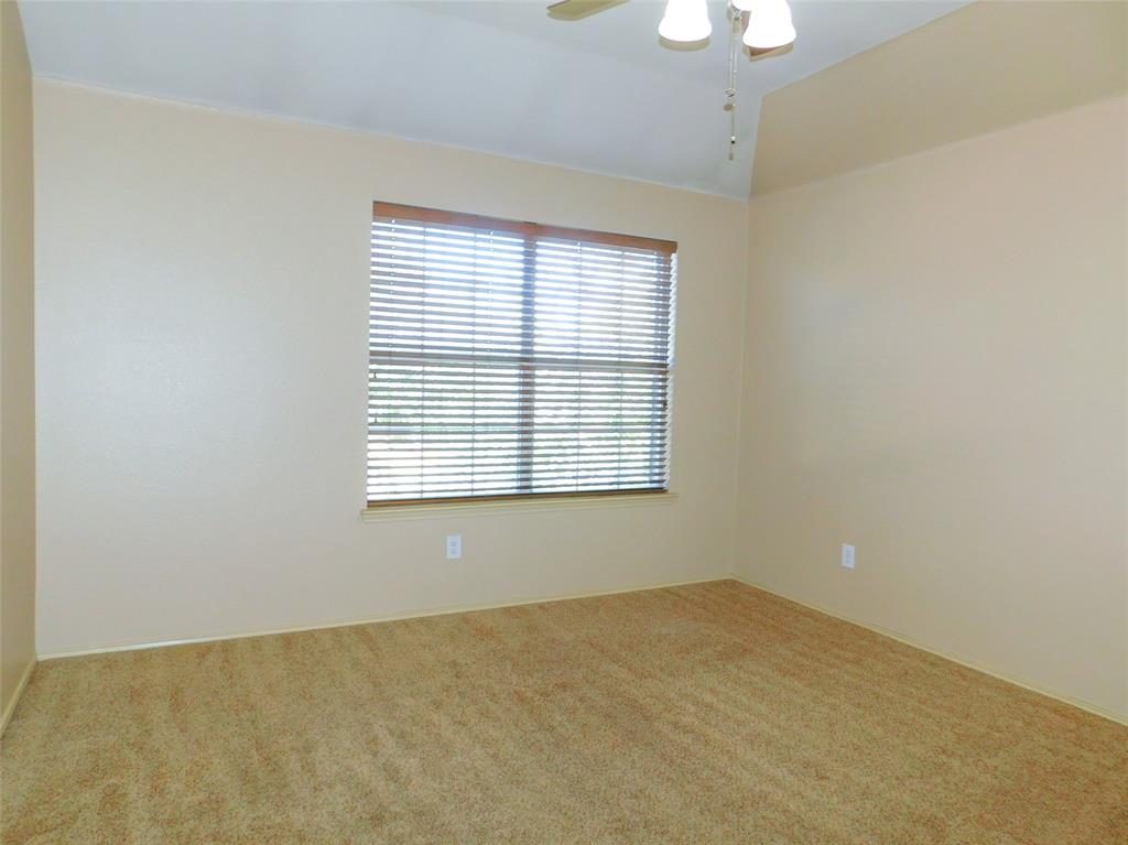 2724 Hereford Road Denton, TX 76210 - Photo 25 of 34 a view of an empty room with a window