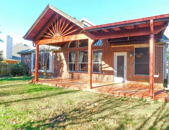 a view of a house with a yard and porch