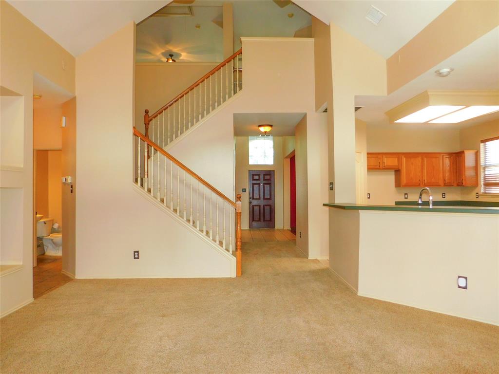 2724 Hereford Road Denton, TX 76210 - Photo 8 of 34 a view of a hallway with staircase
