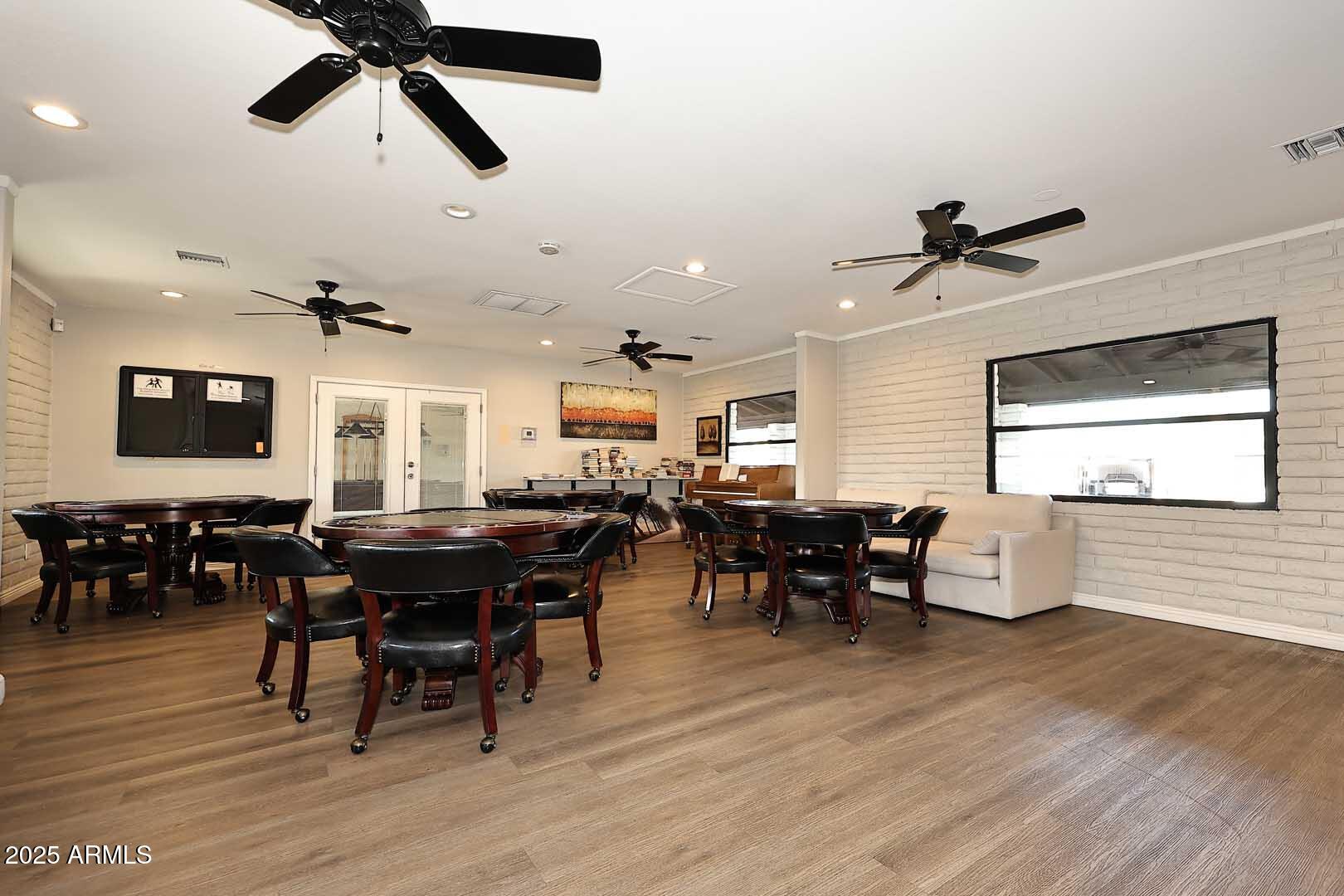 5201 West Camelback Road, Unit 243 Phoenix, AZ 85031 - Photo 26 of 27 a view of a dining room with furniture window and wooden floor