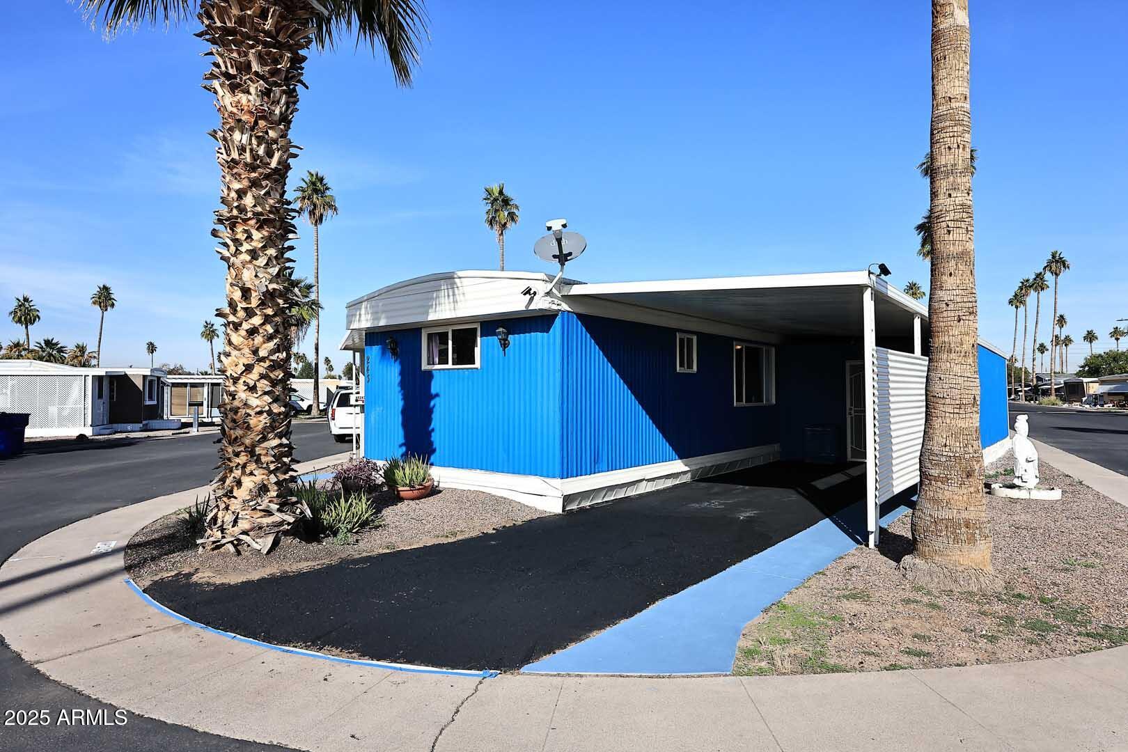 5201 West Camelback Road, Unit 243 Phoenix, AZ 85031 - Photo 3 of 27 a view of a house with a porch