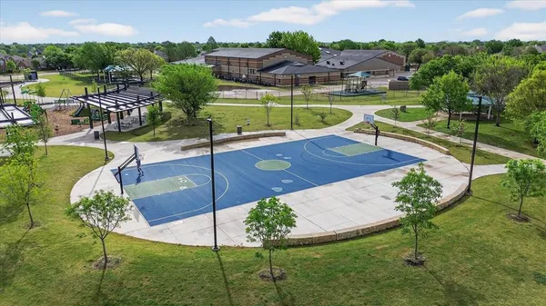 a view of a swimming pool with a yard
