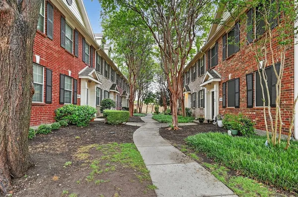 a view of a building with a garden