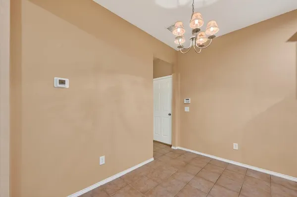 a bathroom with a sink mirror and toilet