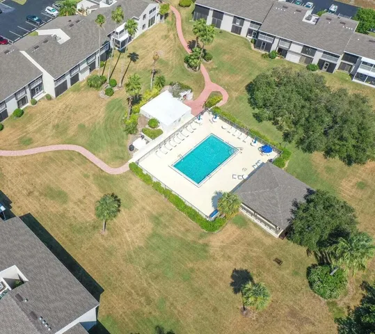 an aerial view of a house with a swimming pool