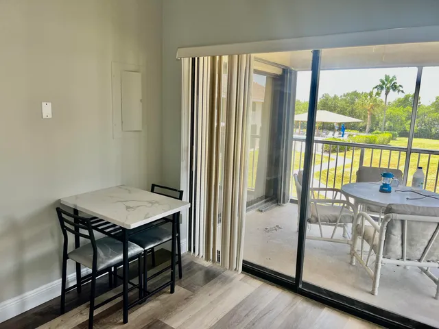 a view of a dining room with furniture