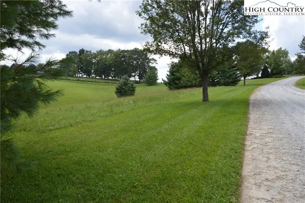 a view of a lake with a yard