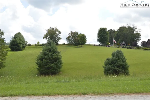 a view of a lake with a big yard