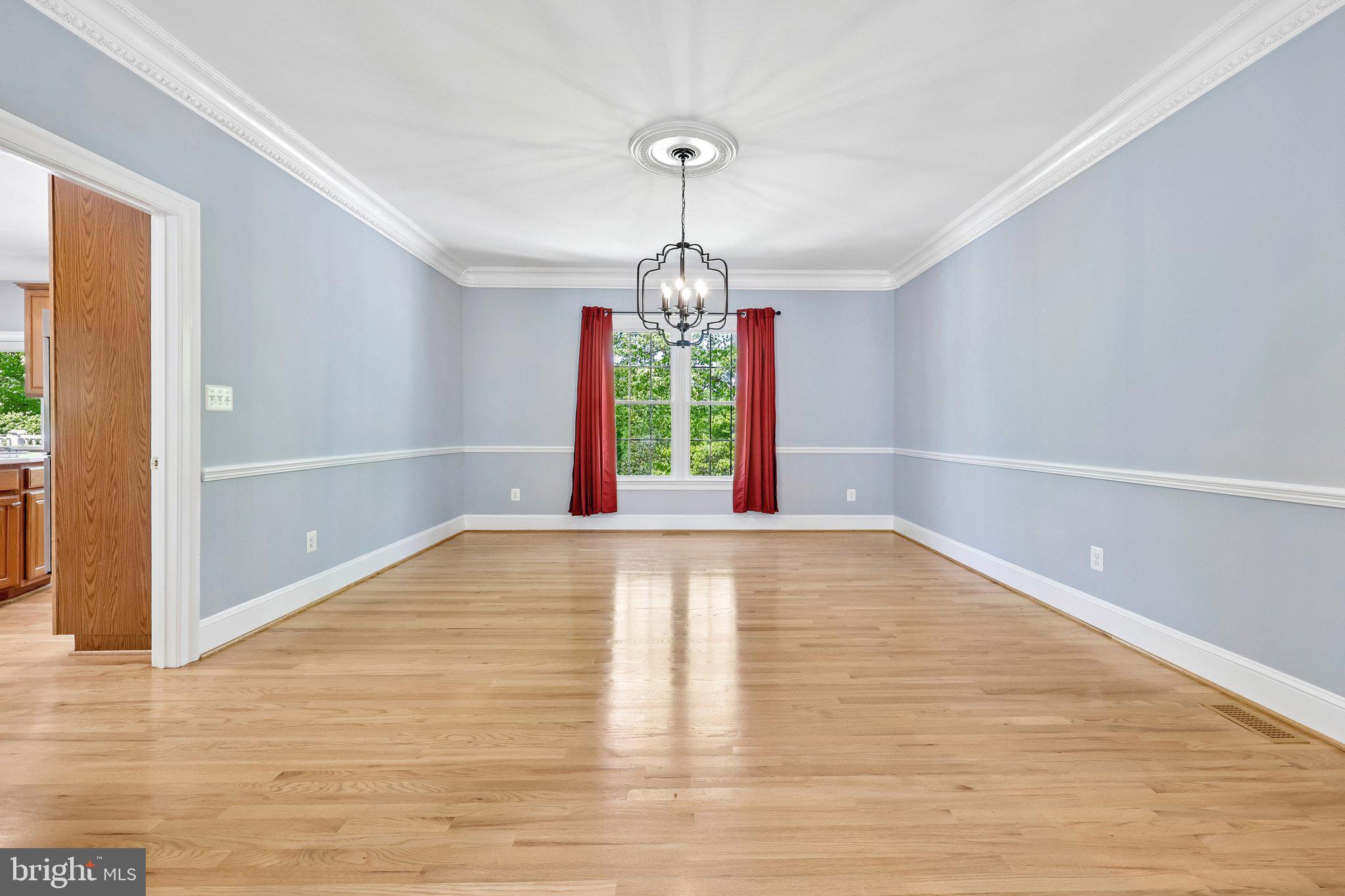 3519 Katrina Court Triangle, VA 22172 - Photo 20 of 101 a view of an empty room with window and wooden floor