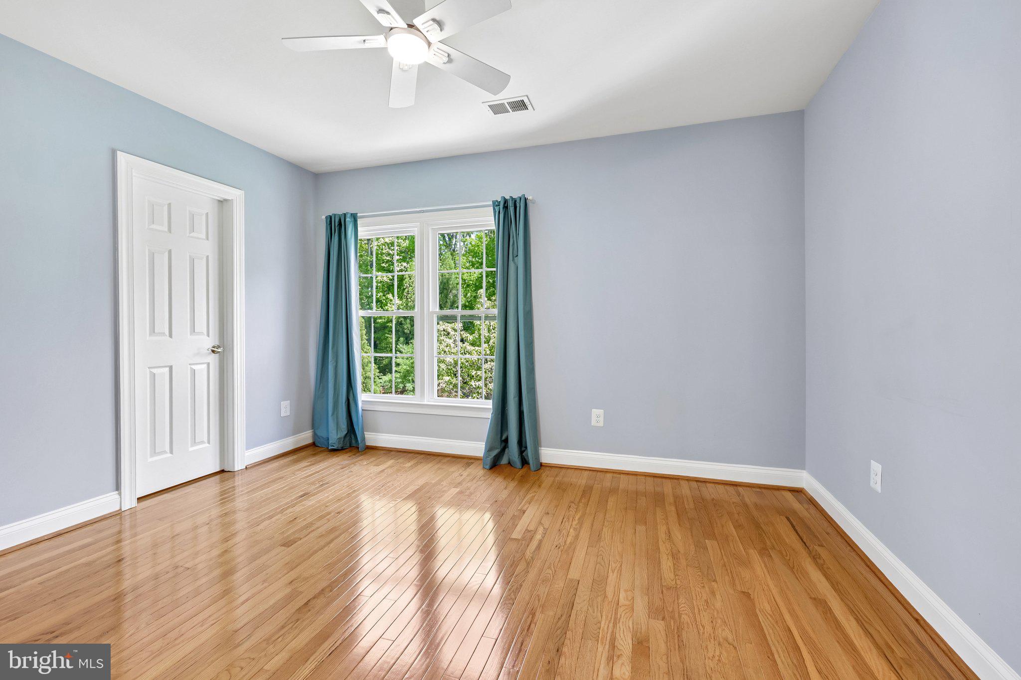 3519 Katrina Court Triangle, VA 22172 - Photo 44 of 101 a view of an empty room with wooden floor and a window