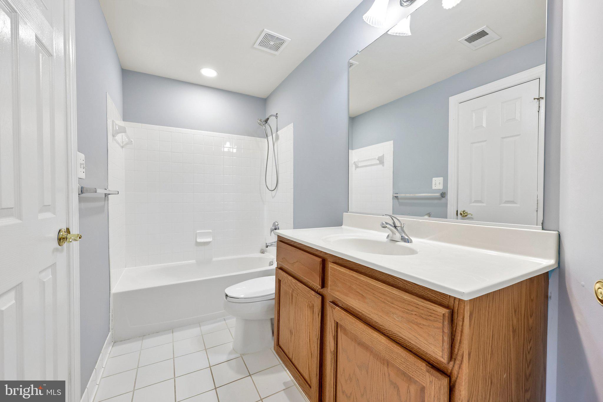 3519 Katrina Court Triangle, VA 22172 - Photo 62 of 101 a bathroom with a sink a toilet and shower
