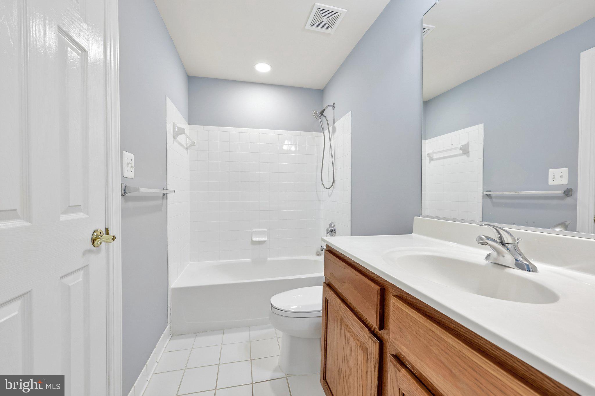 3519 Katrina Court Triangle, VA 22172 - Photo 63 of 101 a bathroom with a sink a toilet a tub and shower