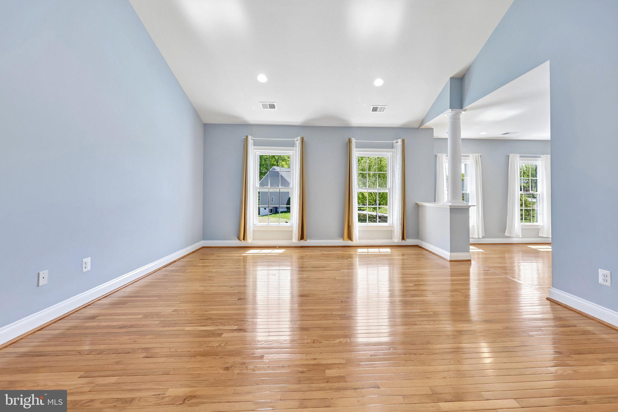 3519 Katrina Court Triangle, VA 22172 - Photo 8 of 101 a view of an empty room with wooden floor and a window