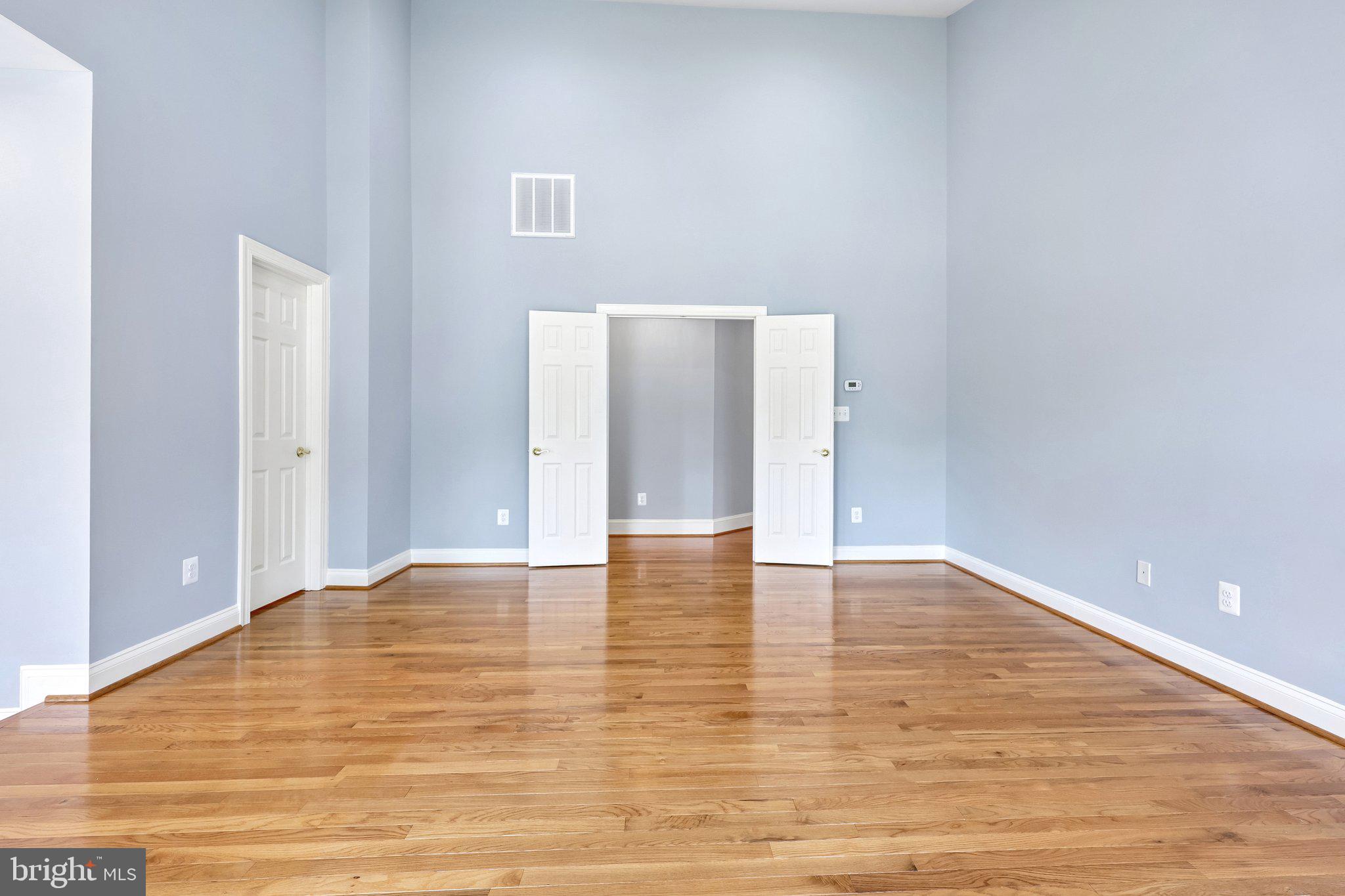 3519 Katrina Court Triangle, VA 22172 - Photo 10 of 101 a view of an empty room with wooden floor and a window