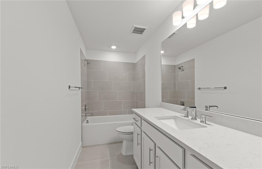 12404 Basalt Lane Alva, FL 33920 - Photo 14 of 50 a bathroom with a sink a toilet and shower