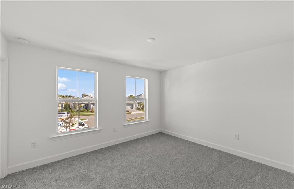 12404 Basalt Lane Alva, FL 33920 - Photo 16 of 50 an empty room with windows