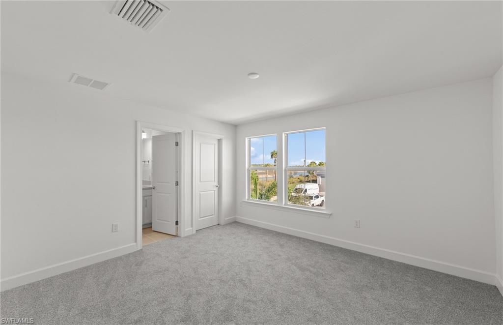 12404 Basalt Lane Alva, FL 33920 - Photo 17 of 50 a view of an empty room with a window