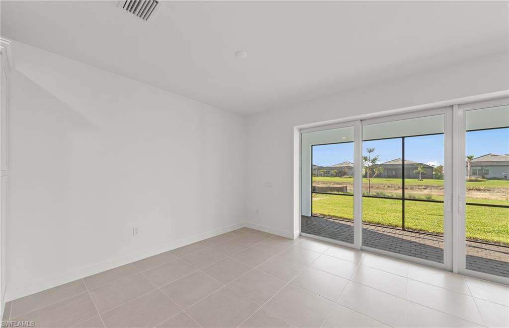 12404 Basalt Lane Alva, FL 33920 - Photo 20 of 50 an empty room with an outdoor view and a window