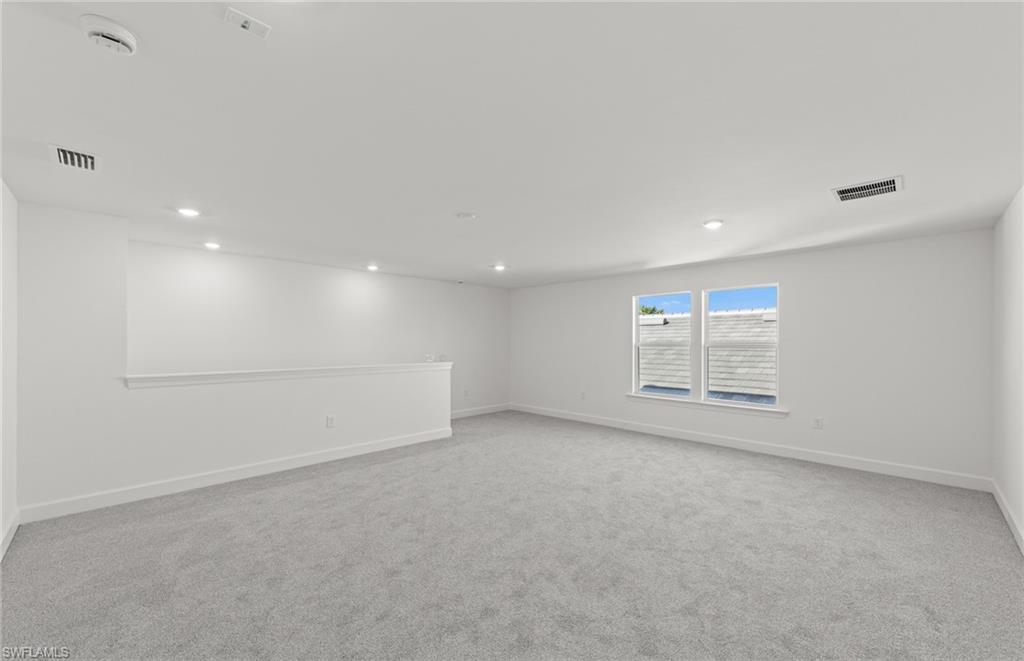 12404 Basalt Lane Alva, FL 33920 - Photo 28 of 50 a view of an empty room with a window