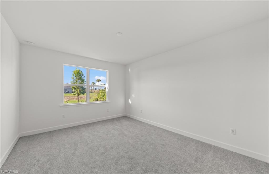 12404 Basalt Lane Alva, FL 33920 - Photo 33 of 50 a view of an empty room and a window