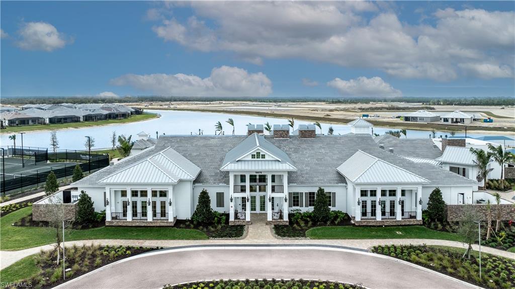12404 Basalt Lane Alva, FL 33920 - Photo 41 of 50 a front view of a house with a garden
