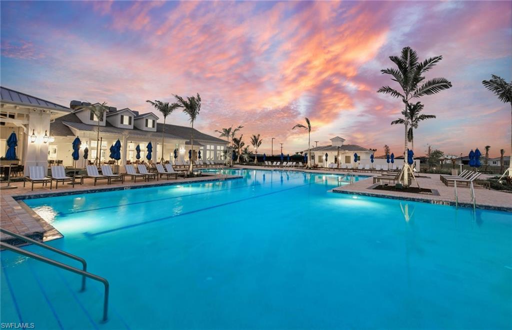 12404 Basalt Lane Alva, FL 33920 - Photo 46 of 50 a view of swimming pool with outdoor seating and a garden