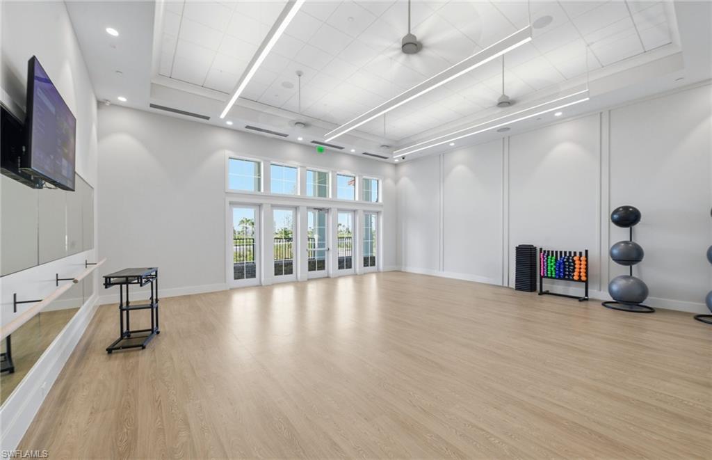 12404 Basalt Lane Alva, FL 33920 - Photo 48 of 50 a view of an empty room with a window and wooden floor