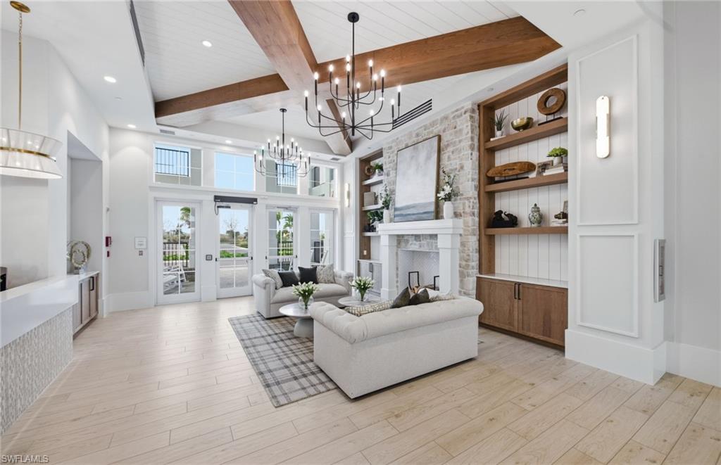 12404 Basalt Lane Alva, FL 33920 - Photo 49 of 50 a living room with furniture and a chandelier