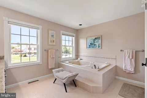 a view of a kitchen with a flat screen tv and wooden floor