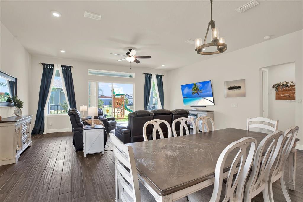 6003 Milestone Drive Apollo Beach, FL 33572 - Photo 13 of 50 a view of a dining room with furniture window and wooden floor