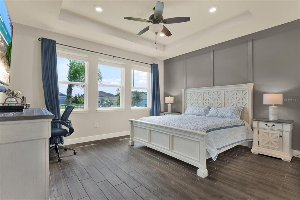 6003 Milestone Drive Apollo Beach, FL 33572 - Photo 15 of 50 a bedroom with a bed and large windows