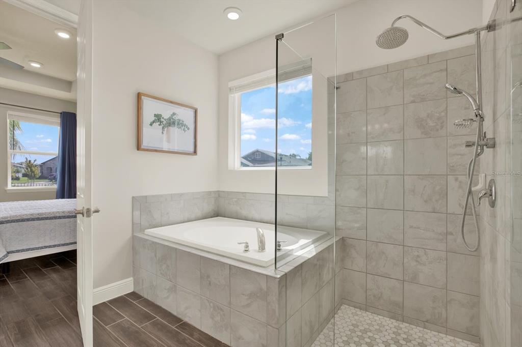 6003 Milestone Drive Apollo Beach, FL 33572 - Photo 18 of 50 a bathroom with a tub and a shower